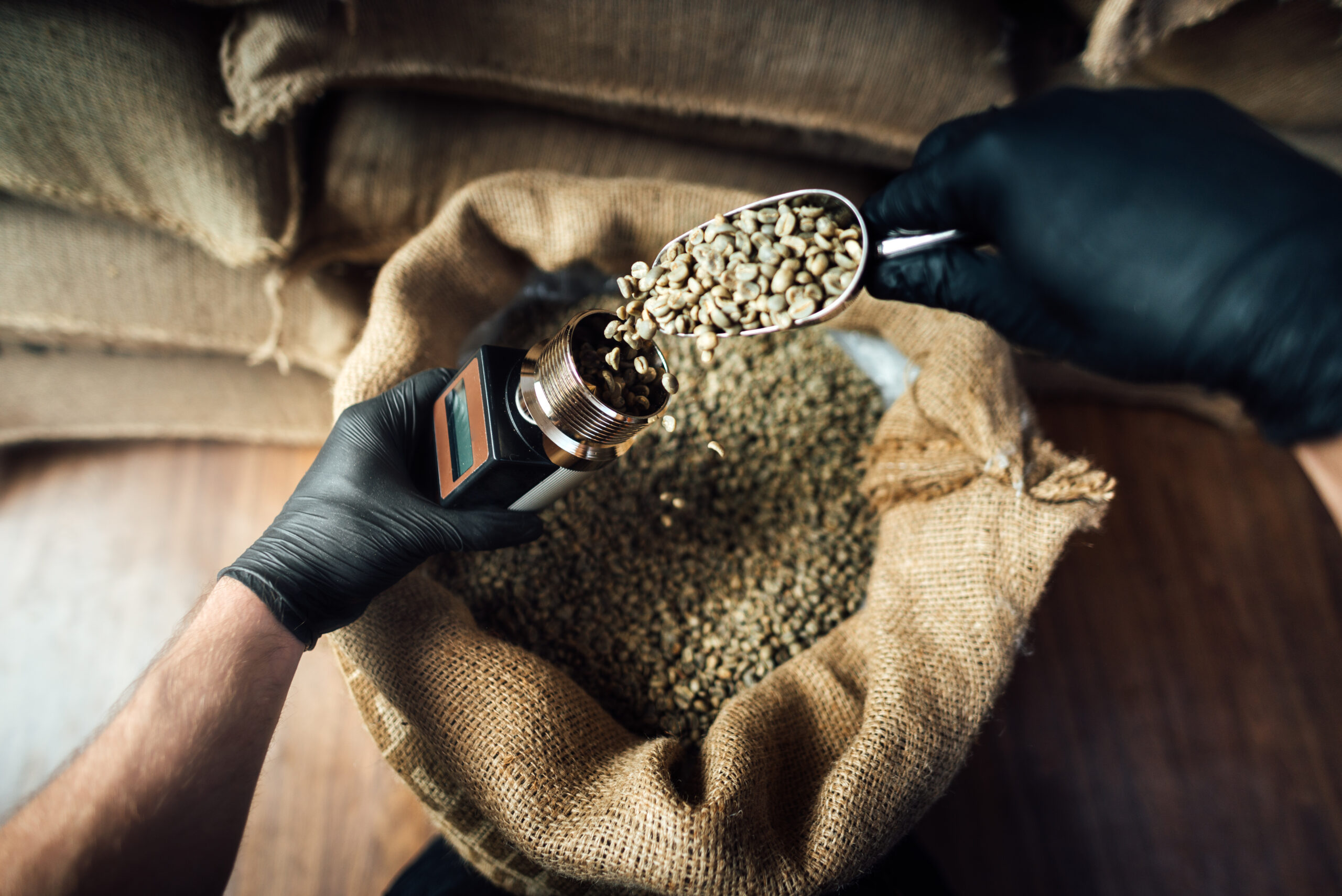 pouring coffee beans into a device for measuring h 2025 01 10 15 12 29 utc scaled - Empresa